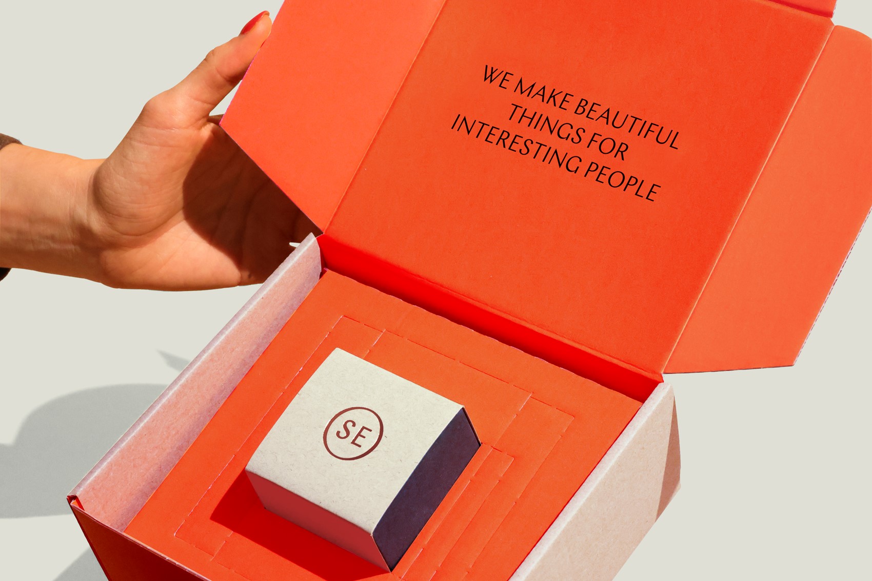 Graphic of a typography specimen showing the alphabet and numerals on top of a dark gray background.